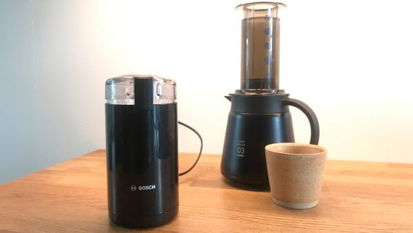 Bosch TSM6A013 coffee mill and Hario Aeropress on kitchen table